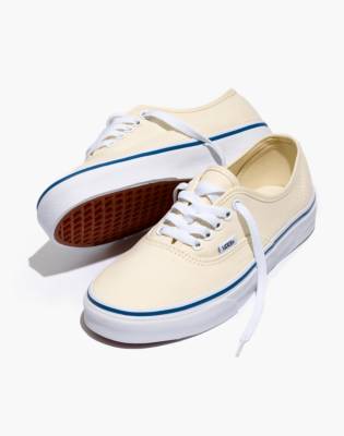 white canvas lace up sneakers