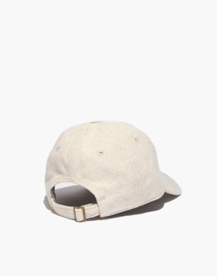 beige baseball cap