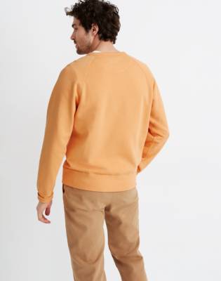 pastel orange sweatshirt